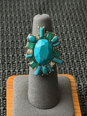 multi-stone like statement ring featuring turquoise and green stones.