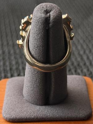 multi-stone like statement ring featuring turquoise and green stones.