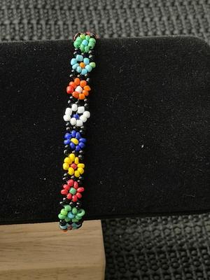 handmade multicolored seed bead daisy chain bracelet.