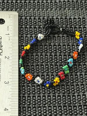 handmade multicolored seed bead daisy chain bracelet.