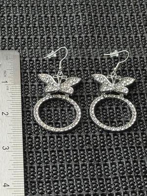 white rhinestone butterfly earrings.