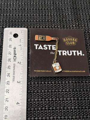 Havana Club rum bottle and domino tile enamel pin set.