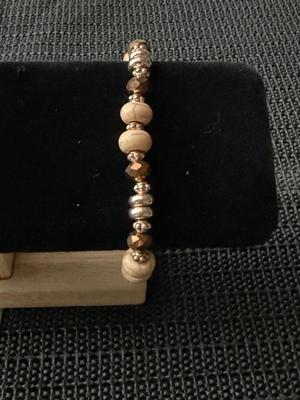 Different beaded brown colored stretch bracelet