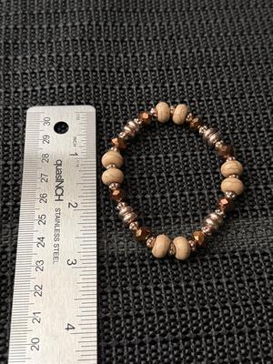 Different beaded brown colored stretch bracelet