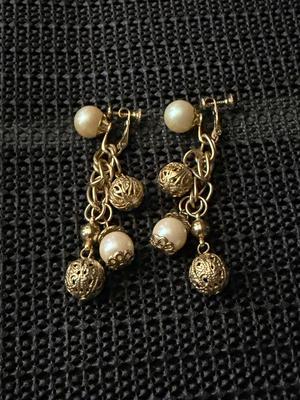 Vintage gold-tone dangle and drop screw-back earrings with faux pearls and filigree balls.