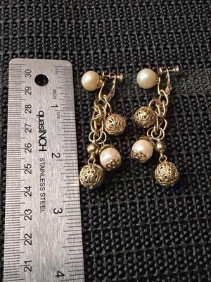 Vintage gold-tone dangle and drop screw-back earrings with faux pearls and filigree balls.