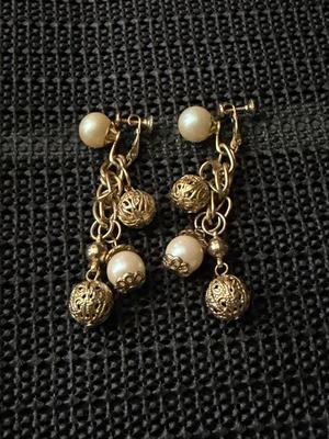 Vintage gold-tone dangle and drop screw-back earrings with faux pearls and filigree balls.