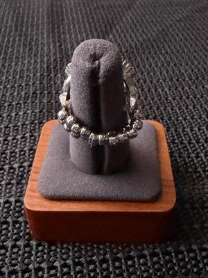 blue ring, featuring a square-cut Montana Blue gem surrounded by white rhinestones in silver pronged fittings.