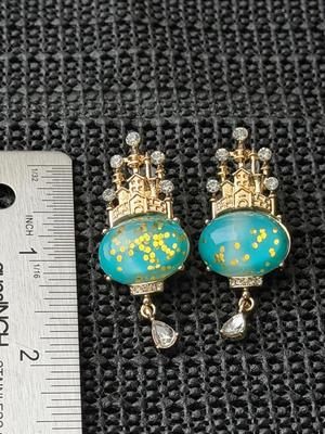 Gold tone dangle castle fashion earrings