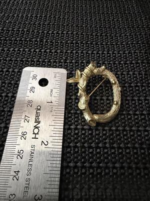 vintage Sarah Coventry gold-tone letter "C" initial pin brooch, featuring a vine branch or bamboo design.