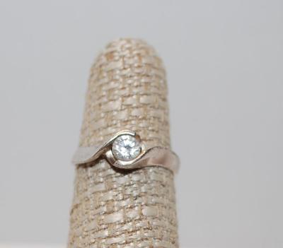 Size 6¼ Solitaire Clear Stone with "Wrap-a-Round" Silver Tone Band (2.4g)