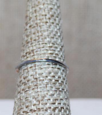 Size 6½ Single Pink Faceted Center Stone Set in a "Nest" Ring with 3 Clear Stones Side Accents and Silver Tone Band (1.2g)