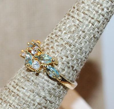 Size 7 ½ Staggered Carolina Blue Marquise Cut Stones & Round Clear Round Stone Accents on a Gold Tone Band (3.0g)