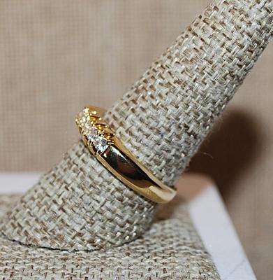 Size 9 Half Infinity Ring with Center Row of 8 Clear Stones on a "Grooved" Gold Tone Setting (5.3g)