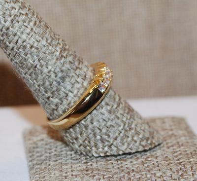 Size 9 Half Infinity Ring with Center Row of 8 Clear Stones on a "Grooved" Gold Tone Setting (5.3g)