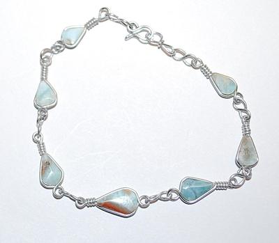 Delicate Pear Shaped Jade-Style BRACELET (2⅛" Opening) with Marked Blue Color Stones and Silver Tone Setting and Wire Hook Clasp