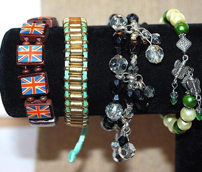 Collection of 4 BRACELETS (-2½"+ Opening) including the British Flag, Green & White Cuff, Etc.