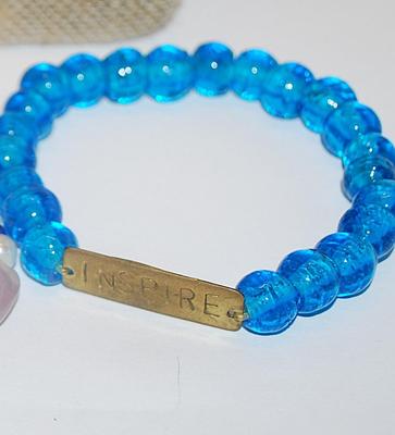 Collection of 3 BRACELETS (2½" Opening) with "INSPIRE" Accent, "Buddha Head" and 1 with Toggle Clasp