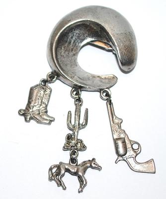 Silver Colored COWBOY HORSESHOE BROOCH (3" x 1½") with Boot, Cactus, Pistol & Horse Accent Dangles on a Silver Tone Setting