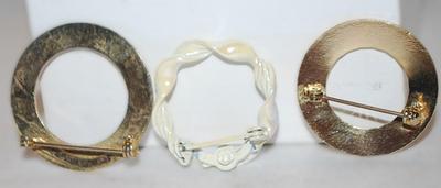 Collection of 3 CIRCLE BROOCHES (1" to 1⅛") including 1 Curled Porcelain Style