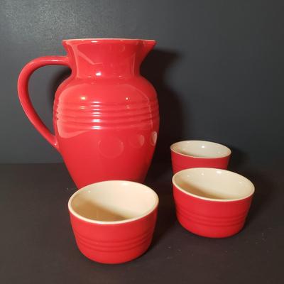 LOT 85K: Le Creuset 9" Cherry Red Pitcher with Ramekins