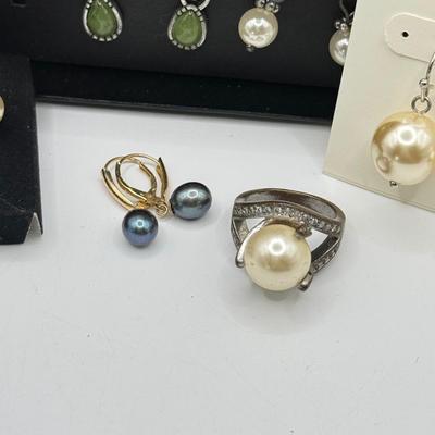 LOT 180: Charms, Large Blue Stone Ring, Loft "Pearl" Earrings & More