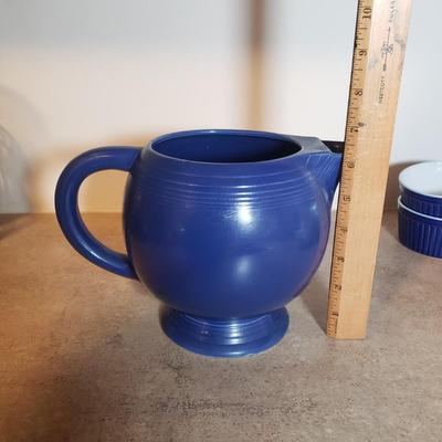 LOT 190K: Fiesta Blue Ice Lip Pitcher with Collection of Dishes & Bakeware
