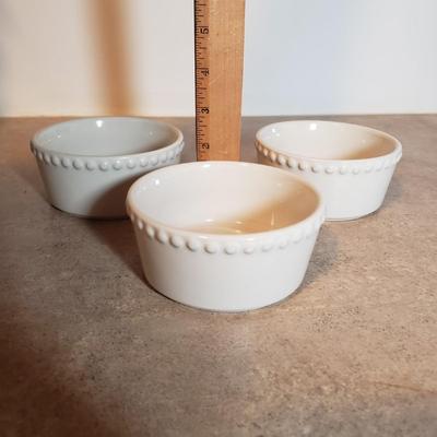 LOT 190K: Fiesta Blue Ice Lip Pitcher with Collection of Dishes & Bakeware