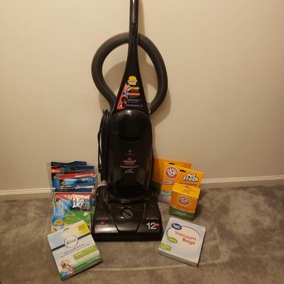 LOT 252M: Bissell 12 Amp Upright Vacuum with Lots of Extra Bags