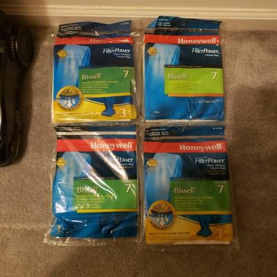 LOT 252M: Bissell 12 Amp Upright Vacuum with Lots of Extra Bags