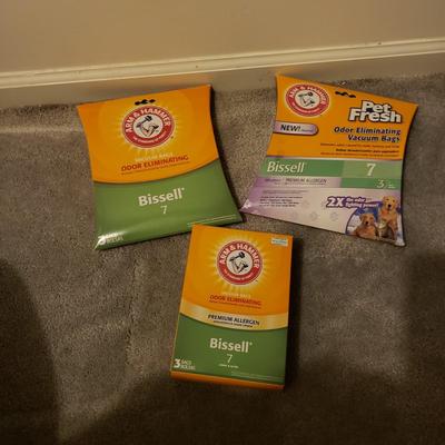 LOT 252M: Bissell 12 Amp Upright Vacuum with Lots of Extra Bags