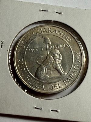 PARAGUAY 1973 UNCIRCULATED LIGHTLY TONED 300 GUARANIES SILVER COIN AS PICTURED.
