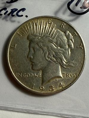 1934-D CIRCULATED CONDITION PEACE SILVER DOLLAR COIN #16 AS PICTURED.