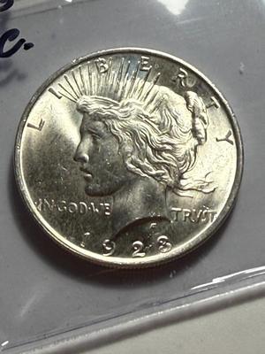 1923-P UNCIRCULATED CONDITION PEACE SILVER DOLLAR COIN #4 AS PICTURED.