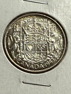CANADA 1953 AU/UNCIRCULATED CONDITION CLEANED OBV 50-CENT SILVER COIN AS PICTURED.