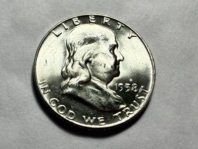 1958-D UNCIRCULATED CONDITION SILVER FRANKLIN HALF DOLLAR AS PICTURED.