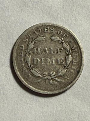 1857 VG/FINE CONDITION LIBERTY SEATED HALF DIME SILVER TYPE COIN AS PICTURED.