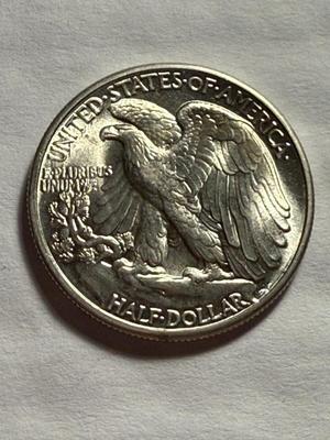 1941-P UNCIRCULATED CONDITION SILVER WALKING LIBERTY HALF DOLLAR AS PICTURED.