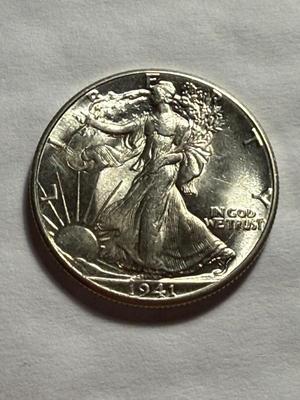 1941-P UNCIRCULATED CONDITION SILVER WALKING LIBERTY HALF DOLLAR AS PICTURED.
