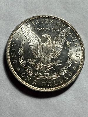 1882-O UNCIRCULATED CONDITION VERY LIGHTLY TONED OBV MORGAN SILVER DOLLAR.