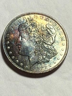 1921-P UNCIRCULATED GORGEOUS OBVERSE TONED MORGAN SILVER DOLLAR AS PICTURED.