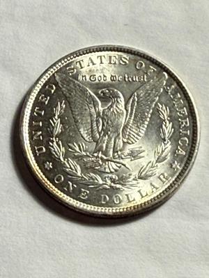 1889-P UNCIRCULATED MORGAN SILVER DOLLAR AS PICTURED.