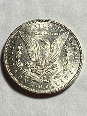 1891-P AU CONDITION LIGHTLY CLEANED MORGAN SILVER DOLLAR.