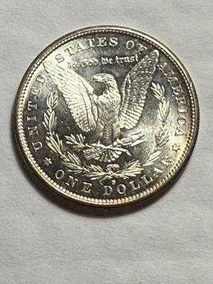 1881-S UNCIRCULATED CONDITION LIGHTLY CLEANED OBVERSE MORGAN SILVER DOLLAR.