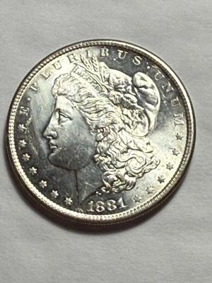 1881-S UNCIRCULATED CONDITION LIGHTLY CLEANED OBVERSE MORGAN SILVER DOLLAR.