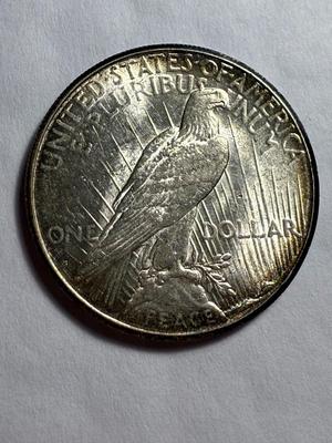 1925-S AU CONDITION LIGHTLY CLEANED PEACE SILVER DOLLAR AS PICTURED.