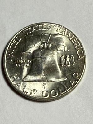1955 UNCIRCULATED CONDITION TONED "BUGS BUNNY" VARIETY FRANKLIN SILVER HALF DOLLAR AS PICTURED.