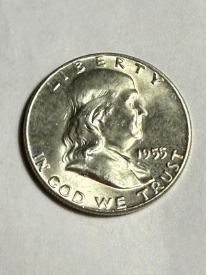 1955 UNCIRCULATED CONDITION TONED "BUGS BUNNY" VARIETY FRANKLIN SILVER HALF DOLLAR AS PICTURED.