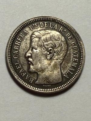 Scarce 1865-R Guatemala 2 Reales Silver Coin in VF Condition as Pictured.