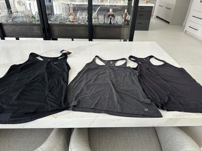 three Ladies athletic top with racerback. 2 are gap fit breathe and New one by Nike dry-fit